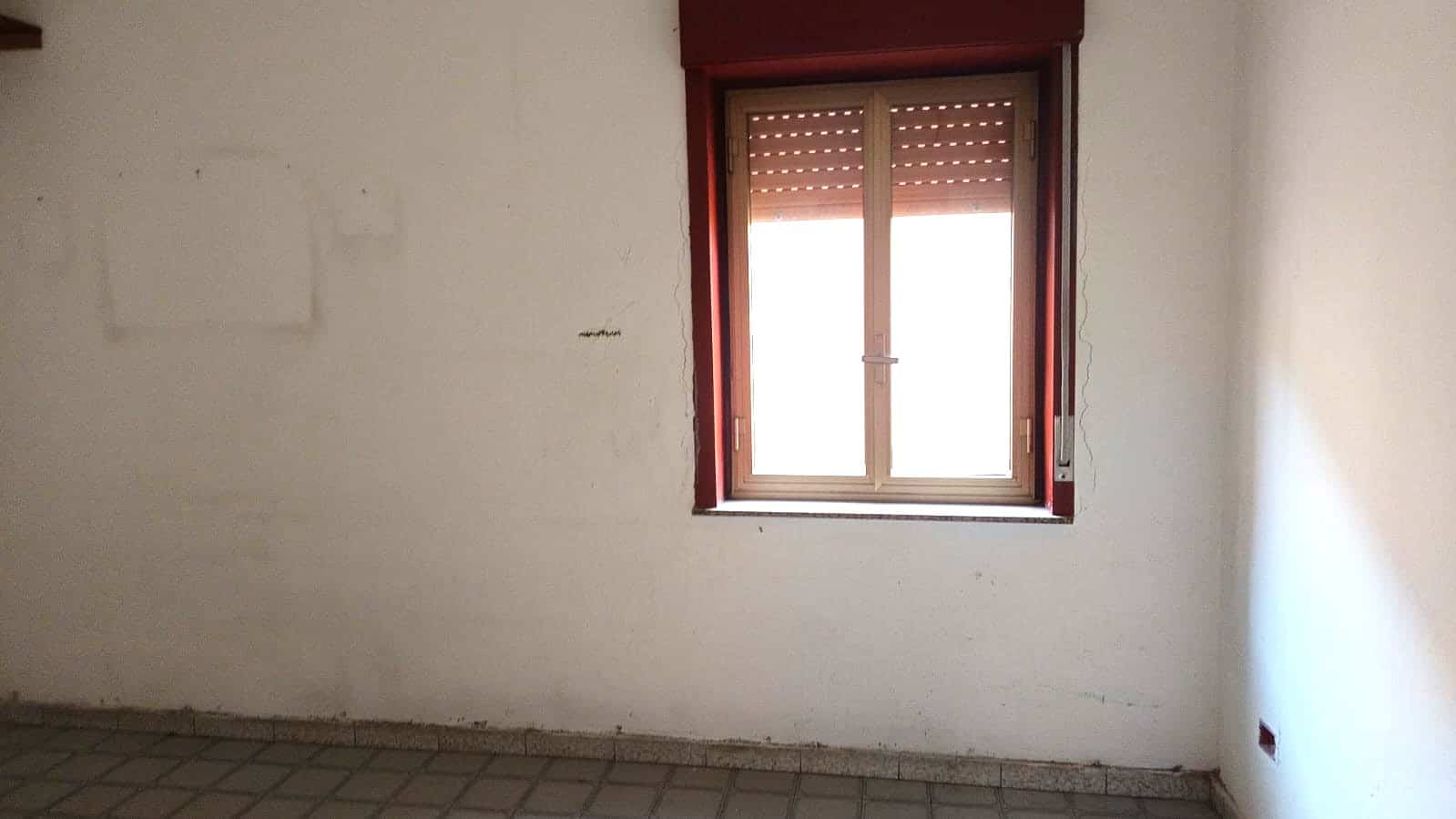 Finestra in una stanza ancora da arredare, progetto di ristrutturazione casa NextCasa.