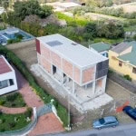 Edificio in costruzione residenziale a NextCasa, con struttura moderna e commercializzazione di immobili nuovi e di qualità.