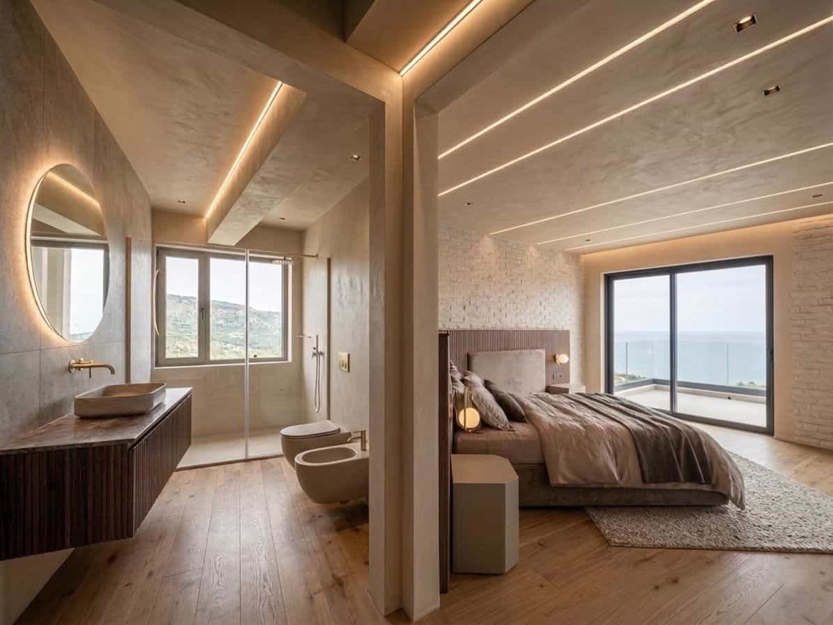 Camera da letto moderna con vista mare, arredi eleganti e illuminazione soffusa, ideale per soggiorni di relax e comfort, in un ambiente luminoso e spazioso.