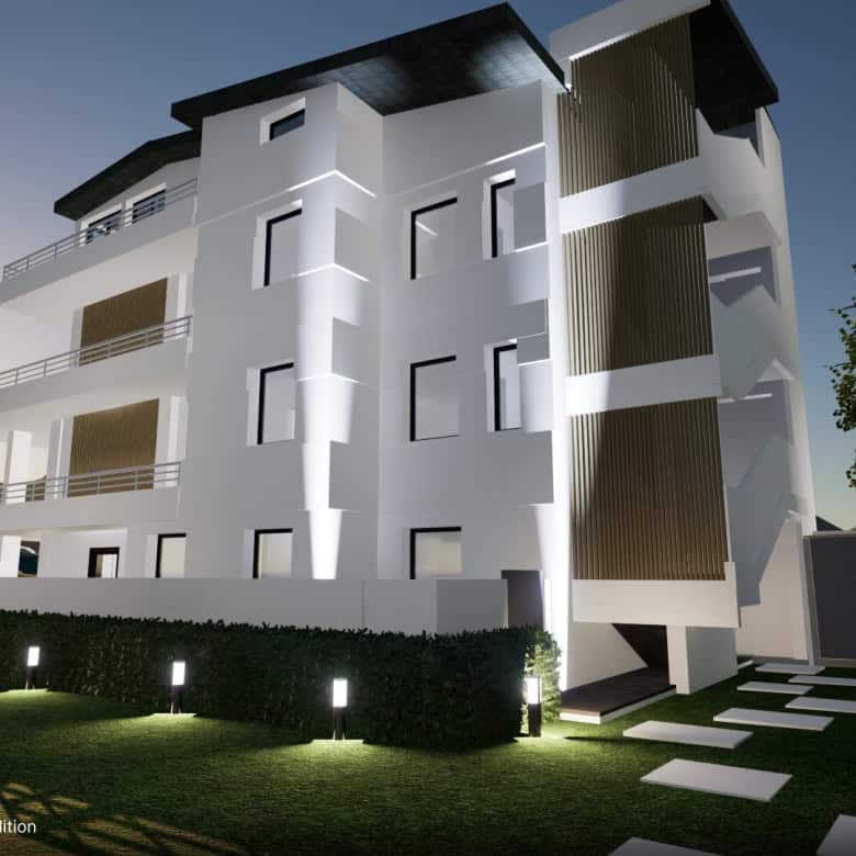 Appartamento moderno in vendita a Capo D'Orlando, vista esterna dell'edificio con balconi e giardino ben curato.
